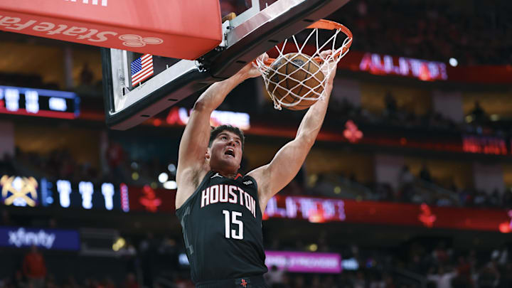 Nov 21, 2025; Houston, Texas, USA; Houston Rockets guard Reed Sheppard (15) dunks the ball during the second quarter against the Denver Nuggets at Toyota Center. Mandatory Credit: Troy Taormina-Imagn Images