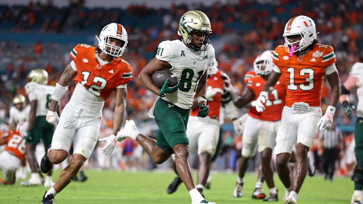 USF wide receiver Christian Neptune scored this touchdown against Miami but the Bulls took their first loss of the season.