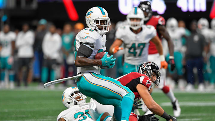 Atlanta Falcons tight end Austin Hooper (81) is hit by Miami Dolphins cornerback Cordrea Tankersley (30) causing an interception by Dolphins free safety Reshad Jones (20) in the last minute of the game during the second half at Mercedes-Benz Stadium in 2017.