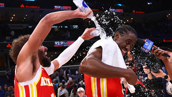 Mar 3, 2025; Memphis, Tennessee, USA; Atlanta Hawks guard Trae Young (11) dumps water on guard Caris LeVert (3) after defeating the Memphis Grizzlies at FedExForum. Mandatory Credit: Petre Thomas-Imagn Images