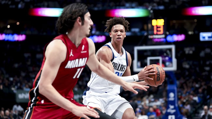 Feb 13, 2025; Dallas, Texas, USA; Dallas Mavericks forward Kessler Edwards (20) looks to pass as Miami Heat guard Jaime Jaquez Jr. (11) defends during the first half at American Airlines Center. Mandatory Credit: Kevin Jairaj-Imagn Images Feb 13, 2025; Dallas, Texas, USA; Dallas Mavericks forward Kessler Edwards (20) looks to pass as Miami Heat guard Jaime Jaquez Jr. (11) defends during the first half at American Airlines Center. Mandatory Credit: Kevin Jairaj-Imagn Images