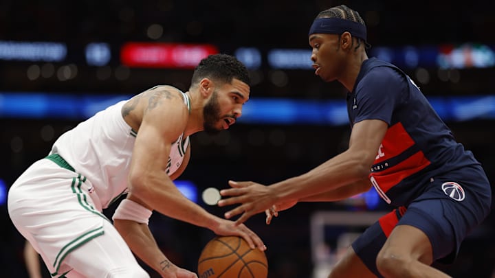 Nov 22, 2024; Washington, District of Columbia, USA; Boston Celtics forward Jayson Tatum (0) dribbles the ball as Washington Wizards guard Bilal Coulibaly (0) defends in the first half at Capital One Arena. Mandatory Credit: Geoff Burke-Imagn Images