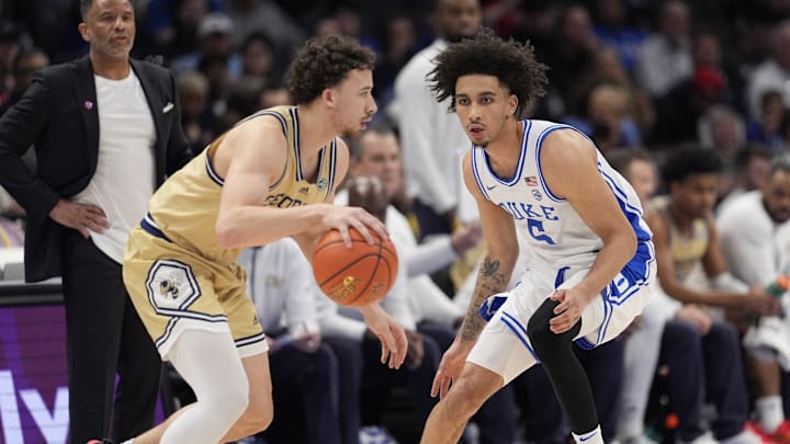 Mar 13, 2025; Charlotte, NC, USA; Georgia Tech Yellow Jackets guard Lance Terry (0) dribbles defended by Duke Blue Devils guard Tyrese Proctor (5) during the second half at Spectrum Center. Mandatory Credit: Jim Dedmon-Imagn Images Mar 13, 2025; Charlotte, NC, USA; Georgia Tech Yellow Jackets guard Lance Terry (0) dribbles defended by Duke Blue Devils guard Tyrese Proctor (5) during the second half at Spectrum Center. Mandatory Credit: Jim Dedmon-Imagn Images