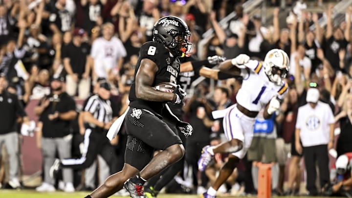Oct 26, 2024; College Station, Texas, USA; Texas A&M Aggies running back Le'Veon Moss (8) runs the ball into the end zone for a touchdown during the first quarter against the LSU Tigers at Kyle Field. Mandatory Credit: Maria Lysaker-Imagn Images. 