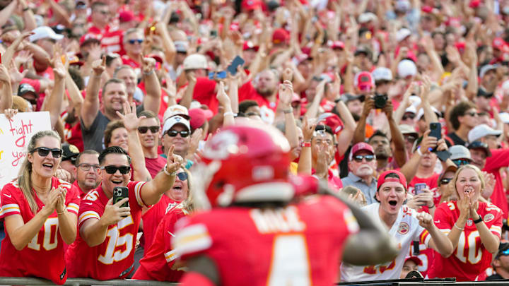 Sep 15, 2024; Kansas City, Missouri, USA; Kansas City Chiefs fans celebrate after a touchdown by Kansas City Chiefs wide receiver Rashee Rice (4) during the first half against the Cincinnati Bengals at GEHA Field at Arrowhead Stadium. Mandatory Credit: Jay Biggerstaff-Imagn Images