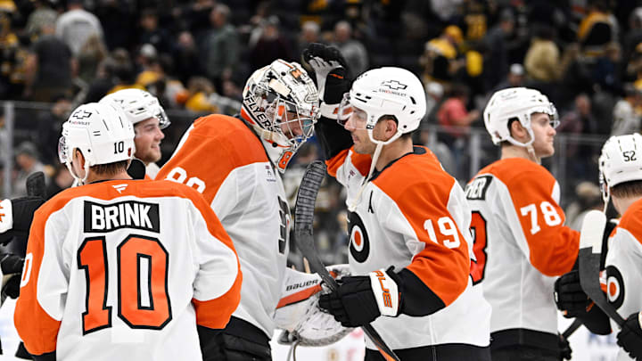 Sep 29, 2025; Boston, Massachusetts, USA;  Philadelphia Flyers right wing Garnet Hathaway (19) and goaltender Dan Vladar (80) celebrate defeating the Boston Bruins after a shootout at TD Garden. Mandatory Credit: Eric Canha-Imagn Images