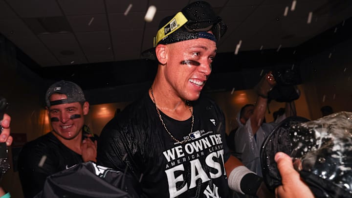Sep 26, 2024; Bronx, New York, USA; New York Yankees center fielder Aaron Judge (99) celebrates after defeating the Baltimore Orioles to clinch the American League East title at Yankee Stadium. Mandatory Credit: Vincent Carchietta-Imagn Images Sep 26, 2024; Bronx, New York, USA; New York Yankees center fielder Aaron Judge (99) celebrates after defeating the Baltimore Orioles to clinch the American League East title at Yankee Stadium. Mandatory Credit: Vincent Carchietta-Imagn Images