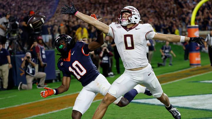 Sep 26, 2025; Charlottesville, Virginia, USA; Florida State Seminoles wide receiver Duce Robinson (0) attempts to catch a pass in the end zone as Virginia Cavaliers defensive back Ja'son Prevard (10) defends during the fourth quarter at Scott Stadium. Mandatory Credit: Geoff Burke-Imagn Images Sep 26, 2025; Charlottesville, Virginia, USA; Florida State Seminoles wide receiver Duce Robinson (0) attempts to catch a pass in the end zone as Virginia Cavaliers defensive back Ja'son Prevard (10) defends during the fourth quarter at Scott Stadium. Mandatory Credit: Geoff Burke-Imagn Images