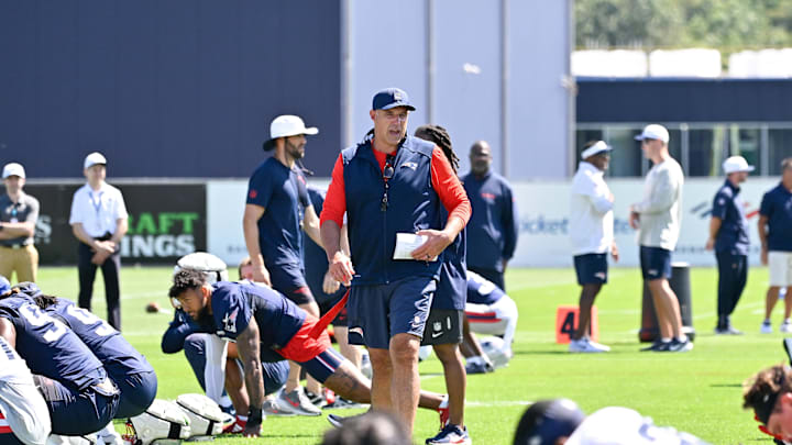 Jul 23, 2025; Foxborough, MA, USA; New England Patriots head coach Mike Vrabel walks though plays warming up before day one of training camp at Gillette Stadium. Mandatory Credit: Eric Canha-Imagn Images
