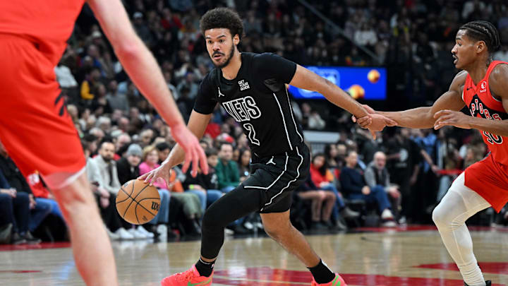 Jan 1, 2025; Toronto, Ontario, CAN;  Brooklyn Nets forward Cam Johnson dribbles the ball against the Toronto Raptors in the first half at Scotiabank Arena. Mandatory Credit: Dan Hamilton-Imagn Images