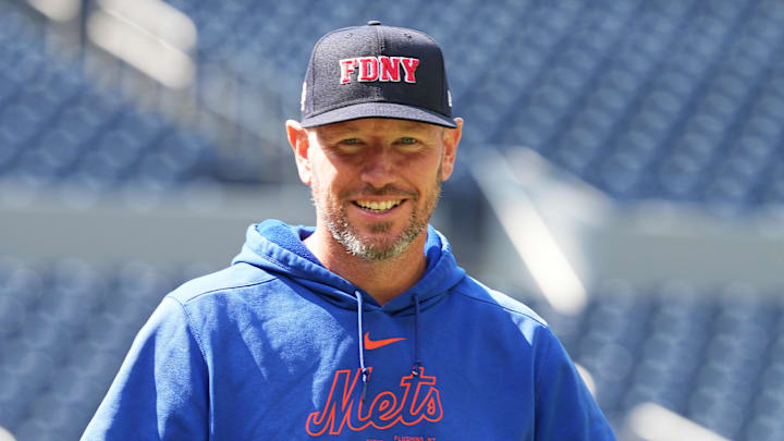 Sep 11, 2024; Toronto, Ontario, CAN; New York Mets pitching coach Jeremy Hefner (65) walks towards the outfield wearing a City of New York Fire Department baseball cap during batting practice before a game against the Toronto Blue Jays at Rogers Centre. Mandatory Credit: Nick Turchiaro-Imagn Images