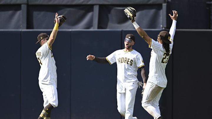 Apr 2, 2025; San Diego, California, USA; San Diego Padres right fielder Brandon Lockridge (28), left, Jackson Merrill (3), center and Fernando Tatis Jr. (23) celebrate after the Padres beat the Cleveland Guardians 5-2 at Petco Park. Mandatory Credit: Denis Poroy-Imagn Images
