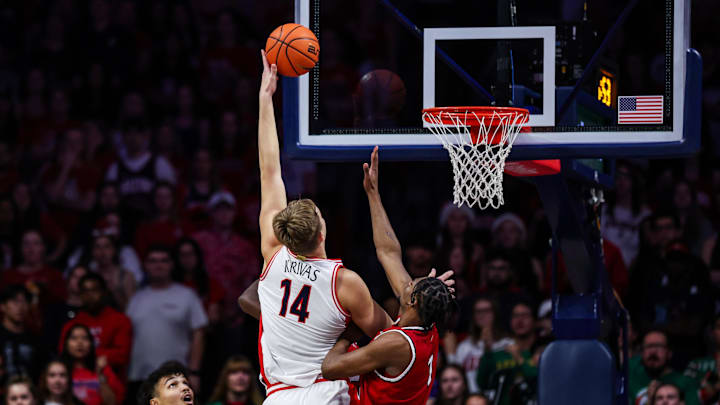 Dec 7, 2024; Tucson, Arizona, USA; Arizona Wildcats center Motiejus Krivas (14) goes for a lay up while Southern Utah Thunderbirds forward Jeffrey Langston Jr. (7) attempts to block him during the first half at McKale Center. Mandatory Credit: Aryanna Frank-Imagn Images Dec 7, 2024; Tucson, Arizona, USA; Arizona Wildcats center Motiejus Krivas (14) goes for a lay up while Southern Utah Thunderbirds forward Jeffrey Langston Jr. (7) attempts to block him during the first half at McKale Center. Mandatory Credit: Aryanna Frank-Imagn Images