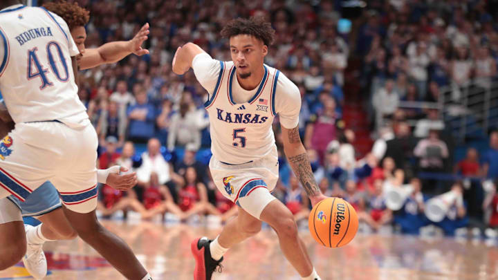 Kansas Jayhawks guard Zeke Mayo (5) drives the ball in the first half of the game against North Carolina Tar Heels inside Allen Fieldhouse Friday, Nov. 8, 2024.