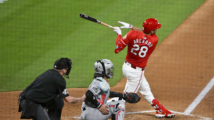 May 23, 2025; St. Louis, Missouri, USA;  St. Louis Cardinals third baseman Nolan Arenado (28) hits a three run triple against the Arizona Diamondbacks during the sixth inning at Busch Stadium. Mandatory Credit: Jeff Curry-Imagn Images
