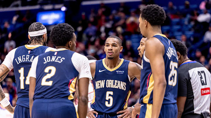 Dec 5, 2024; New Orleans, Louisiana, USA; New Orleans Pelicans guard Dejounte Murray (5) huddles on a free throw attempt by Phoenix Suns guard Devin Booker (1) during the second half at Smoothie King Center. Mandatory Credit: Stephen Lew-Imagn Images Dec 5, 2024; New Orleans, Louisiana, USA; New Orleans Pelicans guard Dejounte Murray (5) huddles on a free throw attempt by Phoenix Suns guard Devin Booker (1) during the second half at Smoothie King Center. Mandatory Credit: Stephen Lew-Imagn Images