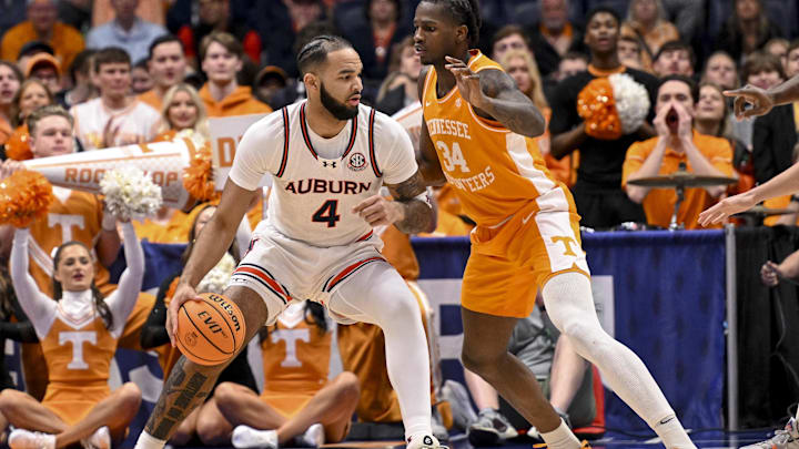 Mar 15, 2025; Nashville, TN, USA;  Auburn Tigers forward Johni Broome (4) backs down Tennessee Volunteers forward Felix Okpara (34) during the first half at Bridgestone Arena. Mandatory Credit: Steve Roberts-Imagn Images