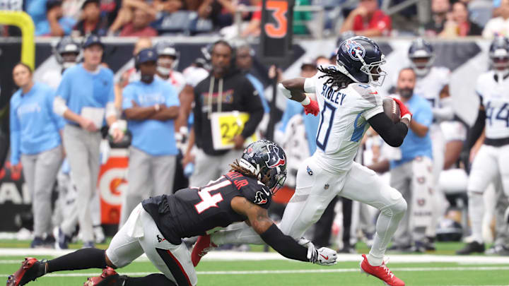 Sep 28, 2025; Houston, Texas, USA; Tennessee Titans wide receiver Calvin Ridley runs against Houston Texans cornerback Derek Stingley Jr. (24) during the first half at NRG Stadium. Mandatory Credit: Troy Taormina-Imagn Images