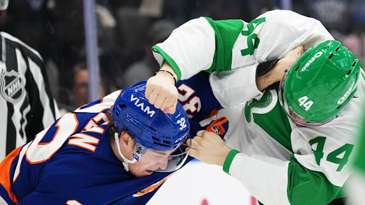 Mar 17, 2026; Toronto, Ontario, CAN; Toronto Maple Leafs defenseman Morgan Rielly (44) fights with New York Islanders center Kyle MacLean (32) during the second period at Scotiabank Arena. Mandatory Credit: Nick Turchiaro-Imagn Images