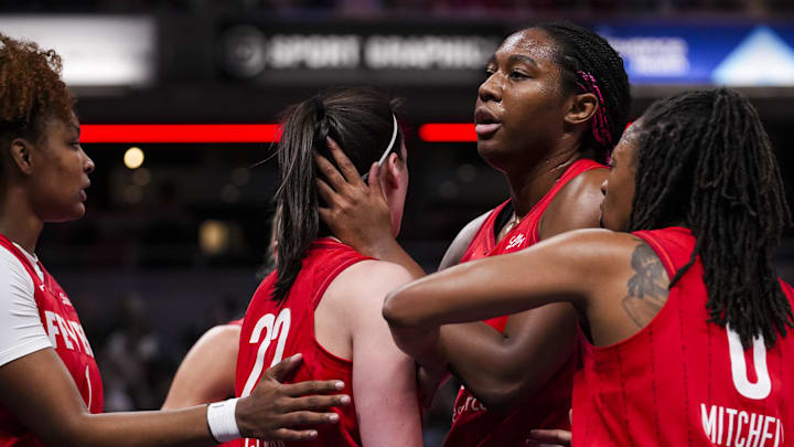 Sep 13, 2024; Indianapolis, Indiana, USA; Indiana Fever forward Aliyah Boston (7) comforts Indiana Fever guard Caitlin Clark (22) after a foul call Friday, Sept. 13, 2024, during a game between the Indiana Fever and the Las Vegas Aces on Friday, Sept. 13, 2024, at Gainbridge Fieldhouse in Indianapolis. Mandatory Credit:  Grace Smith/USA TODAY Network via Imagn Images