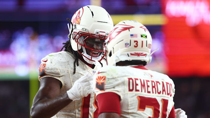 Sep 25, 2025; Glendale, Arizona, USA; Arizona Cardinals running back Emari Demercado (31) celebrates with wide receiver Marvin Harrison Jr. (18) after scoring a touchdown against the Seattle Seahawks in the fourth quarter at State Farm Stadium. Mandatory Credit: Mark J. Rebilas-Imagn Images Sep 25, 2025; Glendale, Arizona, USA; Arizona Cardinals running back Emari Demercado (31) celebrates with wide receiver Marvin Harrison Jr. (18) after scoring a touchdown against the Seattle Seahawks in the fourth quarter at State Farm Stadium. Mandatory Credit: Mark J. Rebilas-Imagn Images