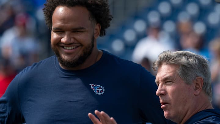 Tennessee Titans offensive tackle John Ojukwu (61) talks with Offensive Line Coach Bill Callahan before their game against the Indianapolis Colts at Nissan Stadium in Nashville, Tenn., Sunday, Oct. 13, 2024.
