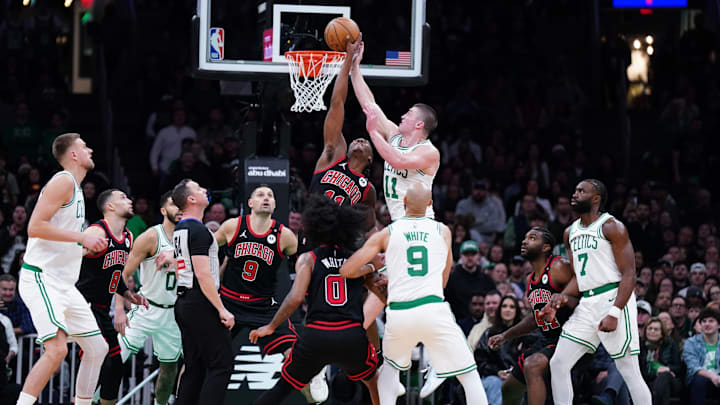 Dec 19, 2024; Boston, Massachusetts, USA; A jump ball with Boston Celtics guard Payton Pritchard (11) and Chicago Bulls guard Ayo Dosunmu (11) in the second half at TD Garden. Mandatory Credit: David Butler II-Imagn Images