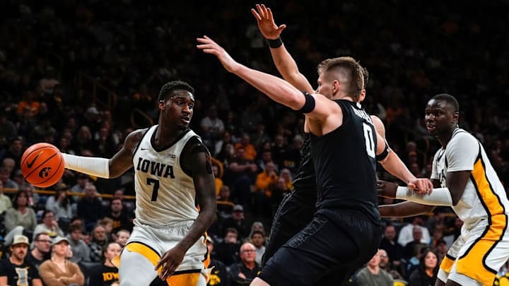 Iowa forward Seydou Traore (7) looks to pass against Michigan State forward Jaxon Kohler (0) during a Big Ten Conference game Thursday, March 6, 2025 at Carver-Hawkeye Arena in Iowa City.
