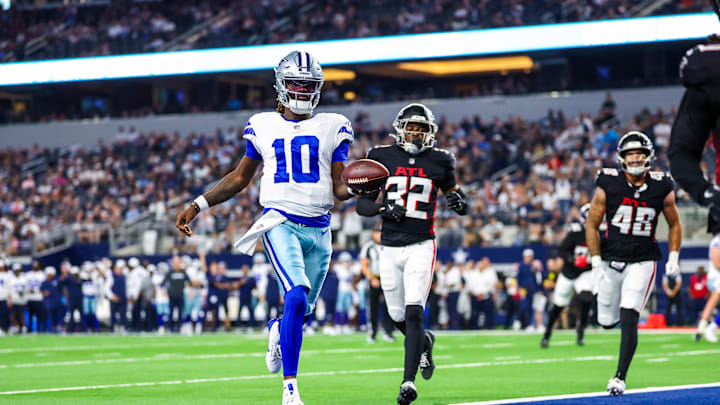 Aug 22, 2025; Arlington, Texas, USA;  Dallas Cowboys quarterback Joe Milton III (10) runs past Atlanta Falcons safety Henry Black (32) to score a touchdown  during the first quarter at AT&T Stadium. Mandatory Credit: Kevin Jairaj-Imagn Images