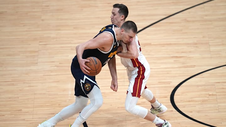 Jun 9, 2023; Miami, Florida, USA; Miami Heat forward Duncan Robinson (55) fouls Denver Nuggets