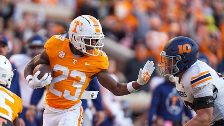 Tennessee running back Cameron Seldon (23) puts his hand up to stop UTEP defensive lineman Hunter Rapolla (10) during a NCAA football game between Tennessee and UTEP in Neyland Stadium on Saturday, November 23, 2024.