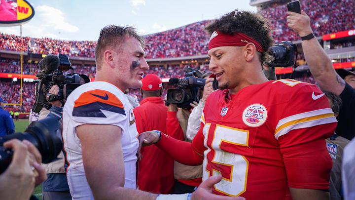 Nov 10, 2024; Kansas City, Missouri, USA; Denver Broncos quarterback Bo Nix (10) talks with Kansas City Chiefs quarterback Patrick Mahomes (15) after the game at GEHA Field at Arrowhead Stadium. Mandatory Credit: Denny Medley-Imagn Images