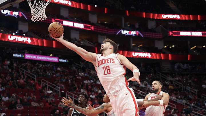 Oct 17, 2024; Houston, Texas, USA; Houston Rockets center Alperen Sengun (28) shoots against San Antonio Spurs guard Brandon Boston Jr. (4) in the fourth quarter at Toyota Center. Mandatory Credit: Thomas Shea-Imagn Images Oct 17, 2024; Houston, Texas, USA; Houston Rockets center Alperen Sengun (28) shoots against San Antonio Spurs guard Brandon Boston Jr. (4) in the fourth quarter at Toyota Center. Mandatory Credit: Thomas Shea-Imagn Images