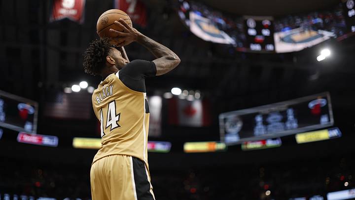 Apr 10, 2026; Washington, District of Columbia, USA; Washington Wizards forward Leaky Black (14) shoots the ball against the Miami Heat in the second half at Capital One Arena. Mandatory Credit: Geoff Burke-Imagn Images