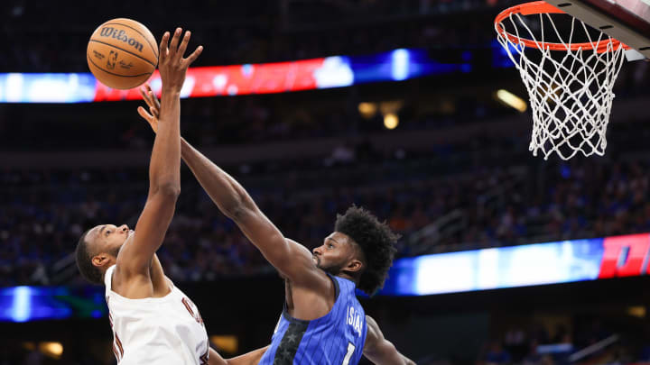 Orlando Magic forward Jonathan Isaac (1) blocks the shot of Cleveland Cavaliers forward Evan Mobley (4) in the fourth quarter during game four of the first round for the 2024 NBA playoffs at Kia Center. 