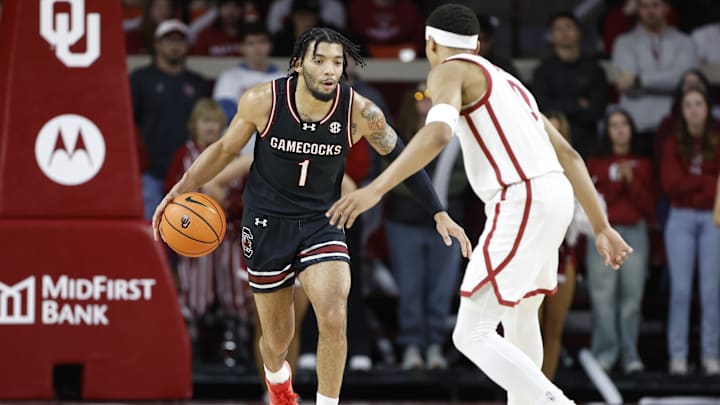 Jan 18, 2025; Norman, Oklahoma, USA; South Carolina Gamecocks guard Jacobi Wright (1) dribbles the ball down the court against Oklahoma Sooners guard Jeremiah Fears (0) during the first half at Lloyd Noble Center. Mandatory Credit: Alonzo Adams-Imagn Images