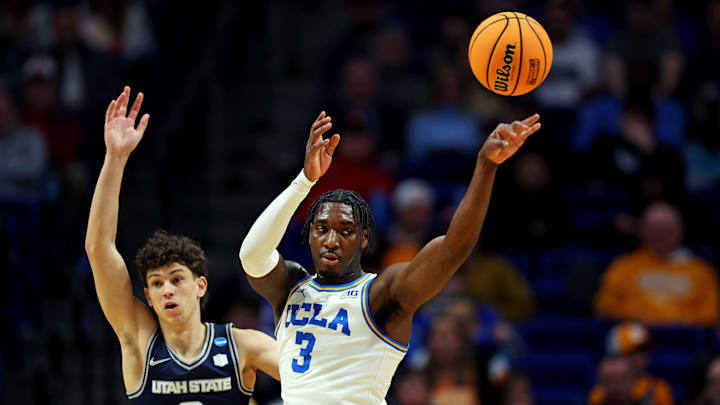 Mar 20, 2025; Lexington, KY, USA; UCLA Bruins guard Eric Dailey Jr. (3) passes the ball against Utah State Aggies guard Drake Allen (8) during the first half in the first round of the NCAA Tournament at Rupp Arena. Mandatory Credit: Jordan Prather-Imagn Images Mar 20, 2025; Lexington, KY, USA; UCLA Bruins guard Eric Dailey Jr. (3) passes the ball against Utah State Aggies guard Drake Allen (8) during the first half in the first round of the NCAA Tournament at Rupp Arena. Mandatory Credit: Jordan Prather-Imagn Images
