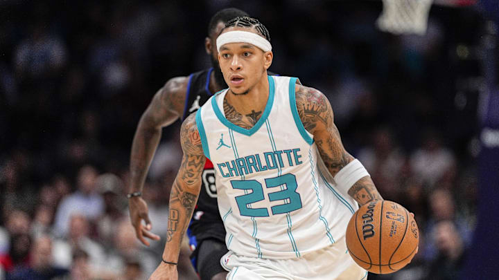 Nov 6, 2024; Charlotte, North Carolina, USA;  Charlotte Hornets guard Tre Mann (23) handles the ball against the Detroit Pistons during the second half at Spectrum Center. Mandatory Credit: Jim Dedmon-Imagn Images