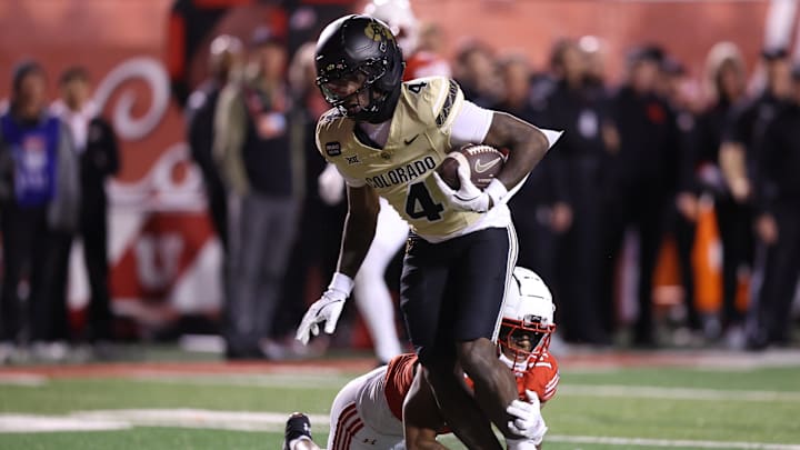 Oct 25, 2025; Salt Lake City, Utah, USA; Colorado Buffaloes wide receiver Omarion Miller (4) is tackled by Utah Utes defensive back JC Hart (14) during the second half at Rice-Eccles Stadium. Mandatory Credit: Rob Gray-Imagn Images Oct 25, 2025; Salt Lake City, Utah, USA; Colorado Buffaloes wide receiver Omarion Miller (4) is tackled by Utah Utes defensive back JC Hart (14) during the second half at Rice-Eccles Stadium. Mandatory Credit: Rob Gray-Imagn Images