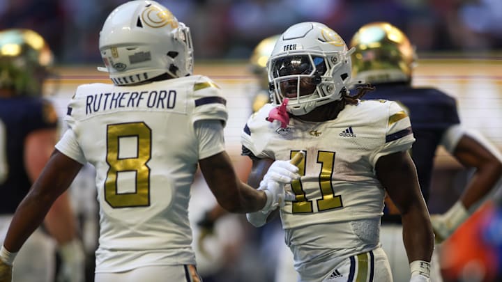 Oct 19, 2024; Atlanta, Georgia, USA; Georgia Tech Yellow Jackets running back Jamal Haynes (11) celebrates with wide receiver Malik Rutherford (8) after scoring a touchdown against the Notre Dame Fighting Irish in the first quarter at Mercedes-Benz Stadium. Mandatory Credit: Brett Davis-Imagn Images