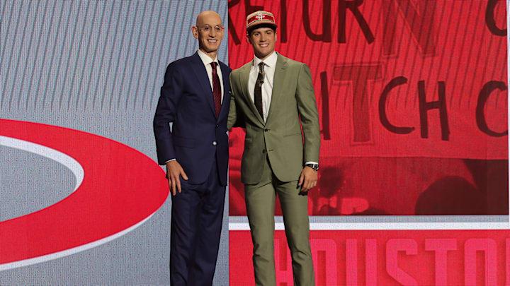 Reed Sheppard poses for photos with NBA commissioner Adam Silver after being selected in the first round. Reed Sheppard poses for photos with NBA commissioner Adam Silver after being selected in the first round.