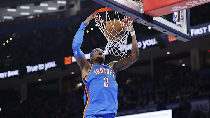 Feb 12, 2025; Oklahoma City, Oklahoma, USA; Oklahoma City Thunder guard Shai Gilgeous-Alexander (2) dunks against the Miami Heat during the second half at Paycom Center. Mandatory Credit: Alonzo Adams-Imagn Images
