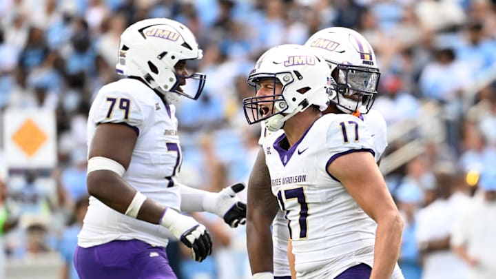 Sep 21, 2024; Chapel Hill, North Carolina, USA; James Madison Dukes tight end Taylor Thompson (17) reacts with offensive lineman Joseph Simmons (79) after scoring a touchdown in the second quarter at Kenan Memorial Stadium. Mandatory Credit: Bob Donnan-Imagn Images