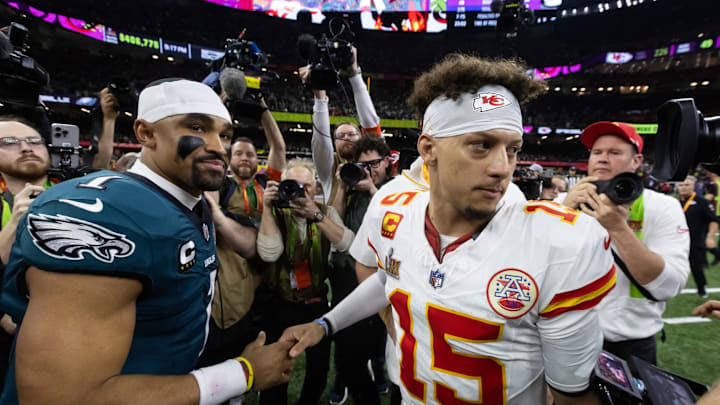Feb 9, 2025; New Orleans, LA, USA; Philadelphia Eagles quarterback Jalen Hurts (1) greets Kansas City Chiefs quarterback Patrick Mahomes (15) following Super Bowl LIX at Ceasars Superdome. Mandatory Credit: Mark J. Rebilas-Imagn Images