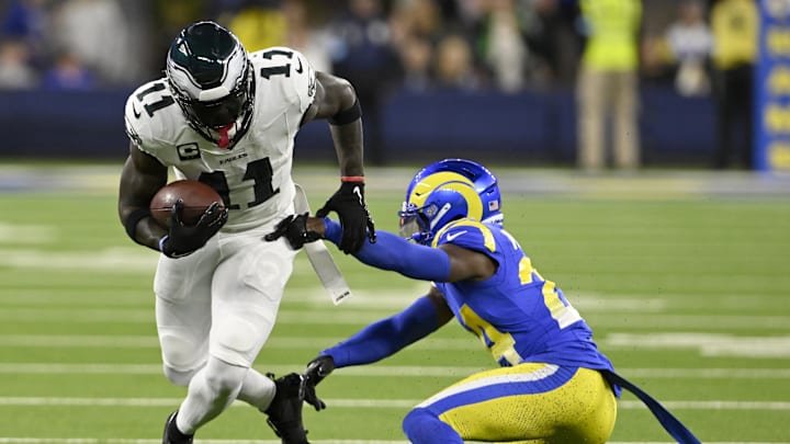 Nov 24, 2024; Inglewood, California, USA;  Philadelphia Eagles wide receiver A.J. Brown (11) spins away from Los Angeles Rams cornerback Darious Williams (24) after a catch-and-run during the first half at SoFi Stadium. Mandatory Credit: Alex Gallardo-Imagn Images