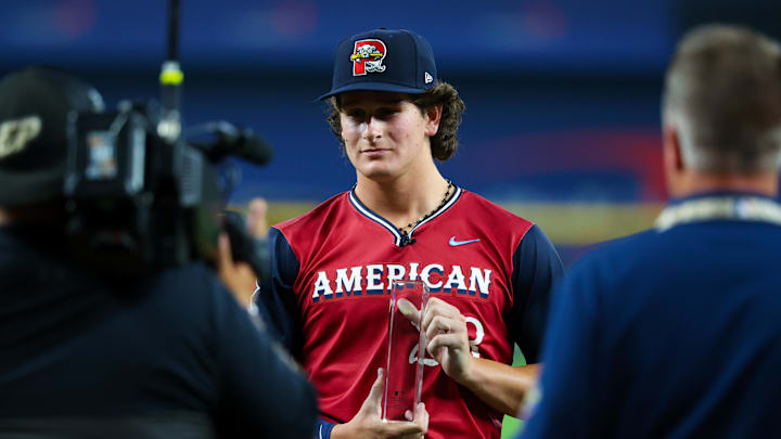 Jul 13, 2024; Arlington, TX, USA;  American League futures outfielder Roman Anthony (23) holds a trophy after winning the Futures Skills Showcase at Globe Life Field.  Mandatory Credit: Kevin Jairaj-Imagn Images