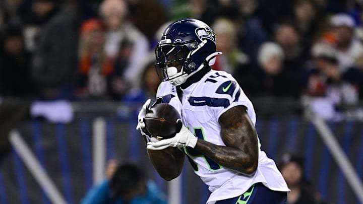 Dec 26, 2024; Chicago, Illinois, USA; Seattle Seahawks wide receiver DK Metcalf (14) makes a catch against the Chicago Bears during the first quarter at Soldier Field. Dec 26, 2024; Chicago, Illinois, USA; Seattle Seahawks wide receiver DK Metcalf (14) makes a catch against the Chicago Bears during the first quarter at Soldier Field.