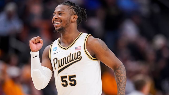 Purdue Boilermakers guard Lance Jones (55) celebrates while jogging off the court 