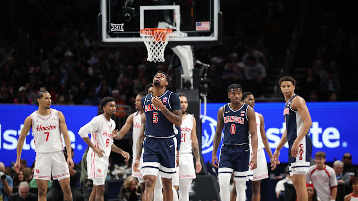 Mar 15, 2025; Kansas City, MO, USA; Arizona Wildcats guard KJ Lewis (5) reacts against the Houston Cougars during the first half for the Big 12 Conference Tournament Championship game at T-Mobile Center. Mandatory Credit: William Purnell-Imagn Images