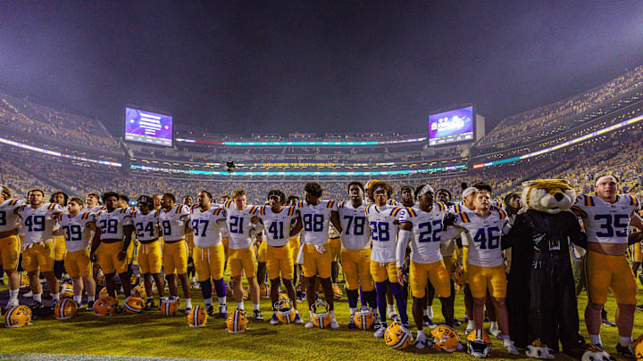 LSU Tigers players line up to sing the school song after the game against the Florida Gators at Tiger Stadium. LSU Tigers players line up to sing the school song after the game against the Florida Gators at Tiger Stadium.